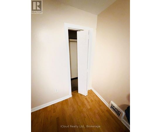 A room with a doorway leading to another room.