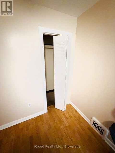 A room with a doorway leading to another room.