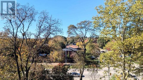 A house surrounded by trees in autumn.