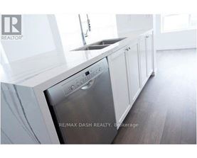 A modern kitchen with a stainless steel dishwasher.
