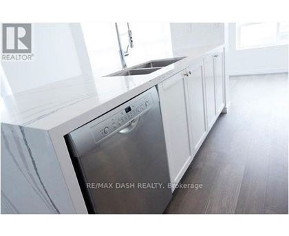 A modern kitchen with a stainless steel dishwasher.
