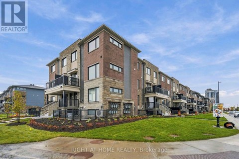 A building with the text "RIGHT AT HOME REALTY, Brokerage" in front of it.