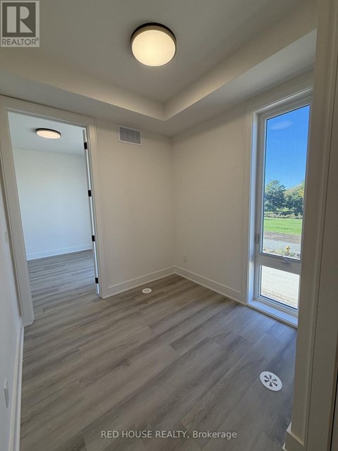 A room with a window and a door in it.