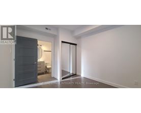 A bedroom with a toilet and a wardrobe.