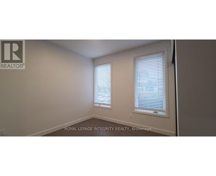 A room with a window and a sign that says "REALTOR".
