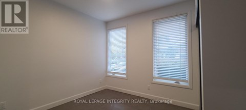 A room with a window and a sign that says "REALTOR".