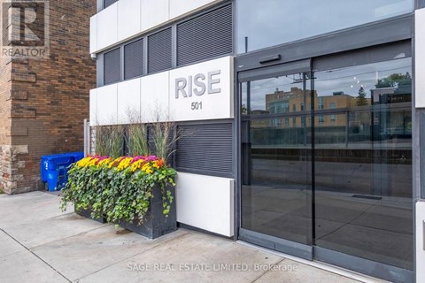 A building with a sign that says "RISE" on it.