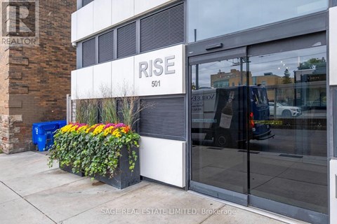 A building with a sign that says "RISE" on it.
