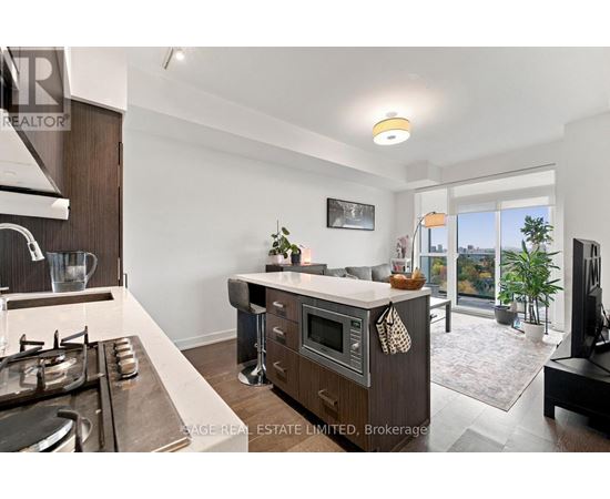 A modern kitchen with a stove top oven and a microwave.