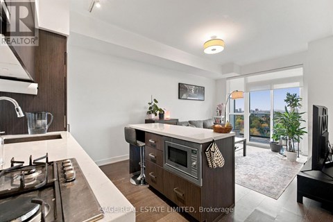 A modern kitchen with a stove top oven and a microwave.