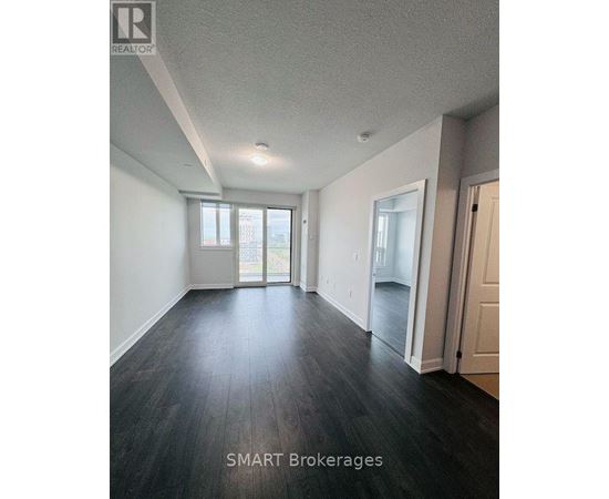 A room with a window and a door is shown.