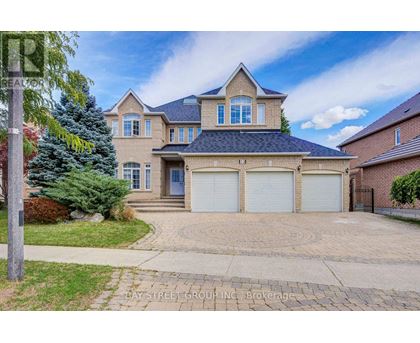 A large house with a driveway in front of it.