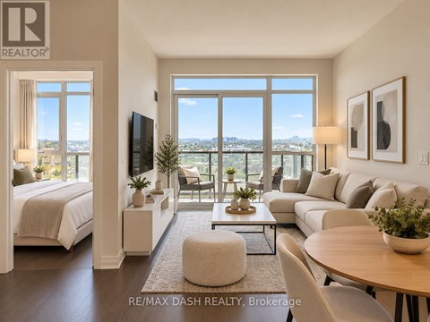 A well-lit, modern living room with a view of the cityscape outside the large windows.