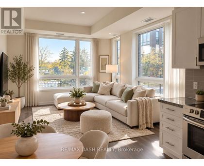 A well-lit, modern living room with a large window and a view of trees outside.