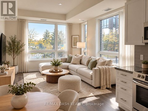 A well-lit, modern living room with a large window and a view of trees outside.