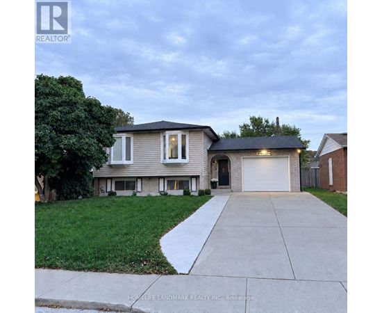 A house with a garage is for sale.