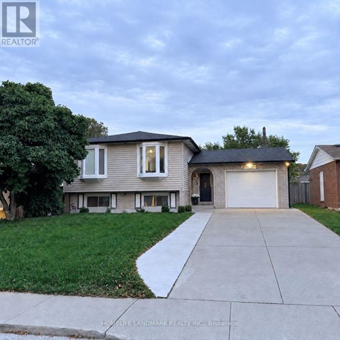A house with a garage is for sale.