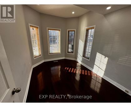 A room with EXP REALTY, Brokerage written on the floor.
