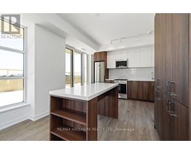 A modern kitchen with wooden cabinets and a central island.