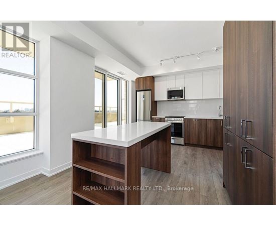 A modern kitchen with wooden cabinets and a central island.