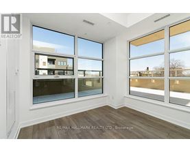 A room with a large window overlooking a building.