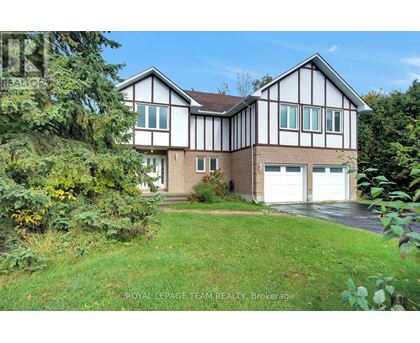 A house with a white garage door is for sale.