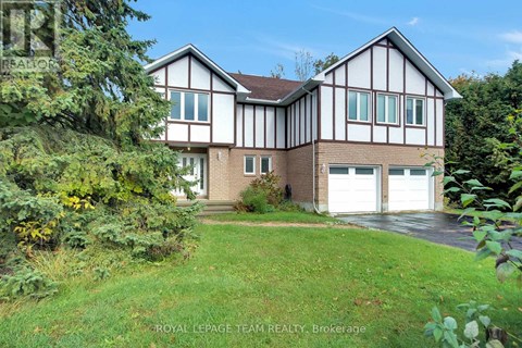 A house with a white garage door is for sale.