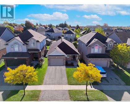 A bird's eye view of a residential neighborhood with houses and trees.