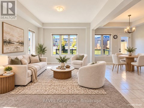 A living room with a couch, chairs, and a coffee table.