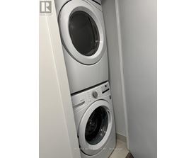 A washing machine and dryer in a small laundry room.