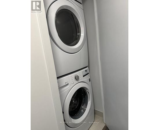 A washing machine and dryer in a small laundry room.