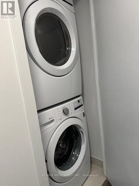 A washing machine and dryer in a small laundry room.