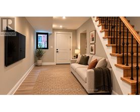 A living room with a couch, a television, and a staircase.