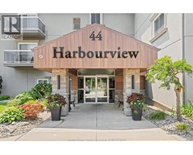 The entrance to a building named Harbourview with a number 44 on it.