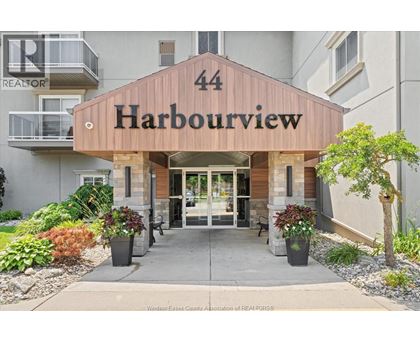 The entrance to a building named Harbourview with a number 44 on it.