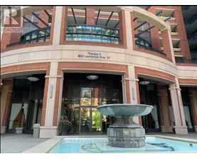 A building with a fountain in front of it.