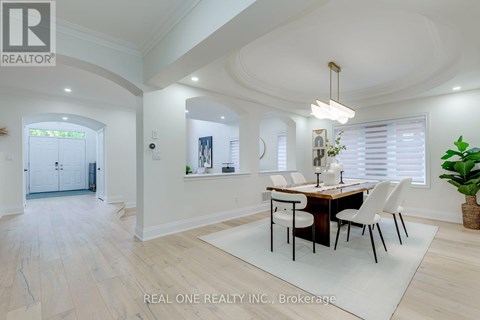 A dining room with a table set for four.