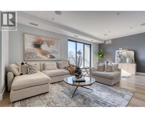 A living room with a large painting of a fox on the wall.