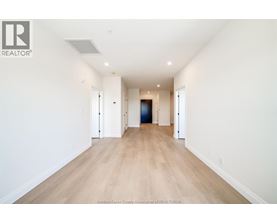 A long hallway with a door at the end.