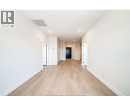 A long hallway with a door at the end.