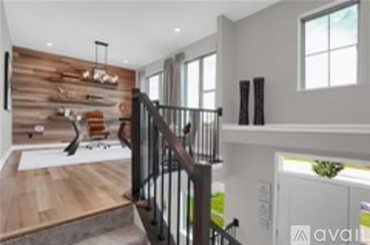 A modern interior with a staircase leading to the upper floor.