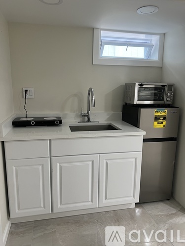 A kitchen with a sink and cabinets.