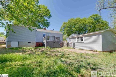 A house with a garage is for sale.