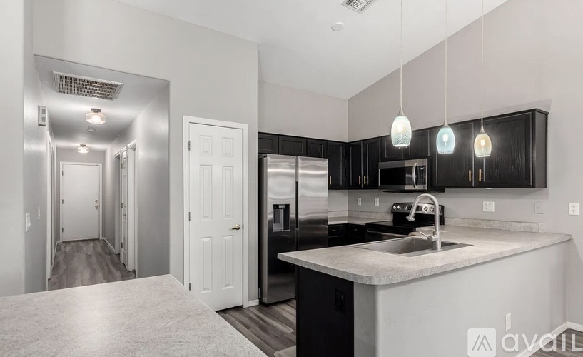 A kitchen with a sink and cabinets.