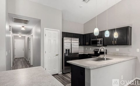 A kitchen with a sink and cabinets.