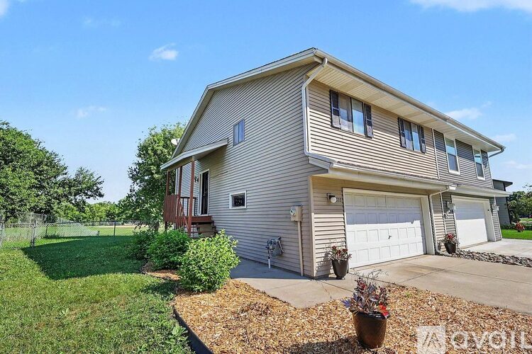 A house with a garage and a driveway.