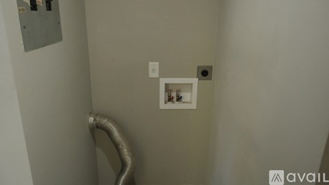 A white electrical outlet with a picture of a dog and a cat on it.