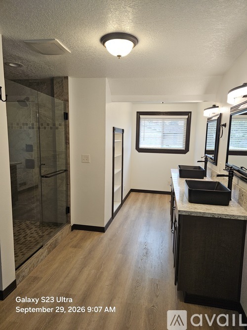 A kitchen with a sink and a window.