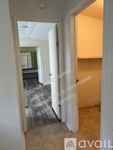 A hallway with a sign that says "Do not say online. Transaction is only for person."