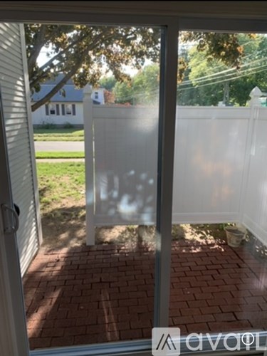 A glass door with a handle is open.